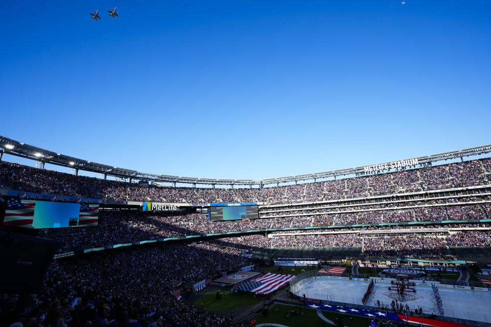Military aircraft perform a flyover before an NHL Stadium Series hockey game between the New York Rangers and the New York Islanders in East Rutherford, N.J., Sunday, Feb. 18, 2024. (AP Photo/Seth Wenig)