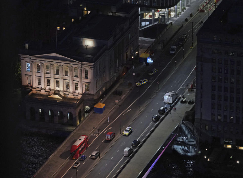 The scene on London Bridge in central London, Saturday, Nov. 30, 2019, after an attack on London Bridge on Friday. UK counterterrorism police on Saturday searched for clues into how a man imprisoned for terrorism offenses before his release last year managed to stab several people before being tackled by bystanders and shot dead by officers on London Bridge. Two people were killed and three wounded. (Yui Mok/PA via AP)