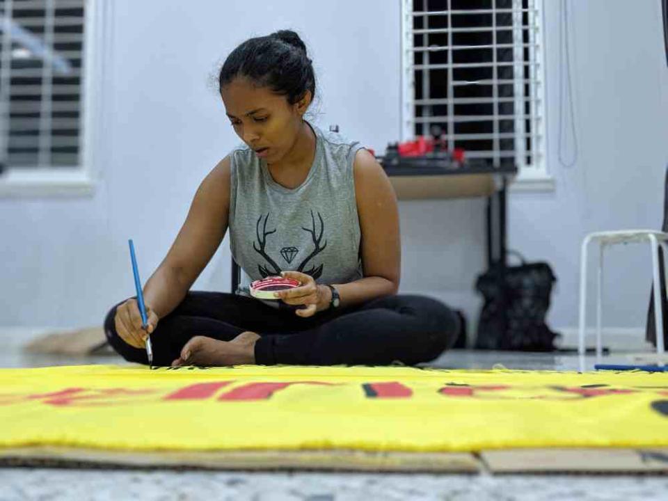 KAMY co-founder Nia Raj making a banner ahead of the Global Climate Strike protest which will start at Sogo KL. ― Picture courtesy of KAMY