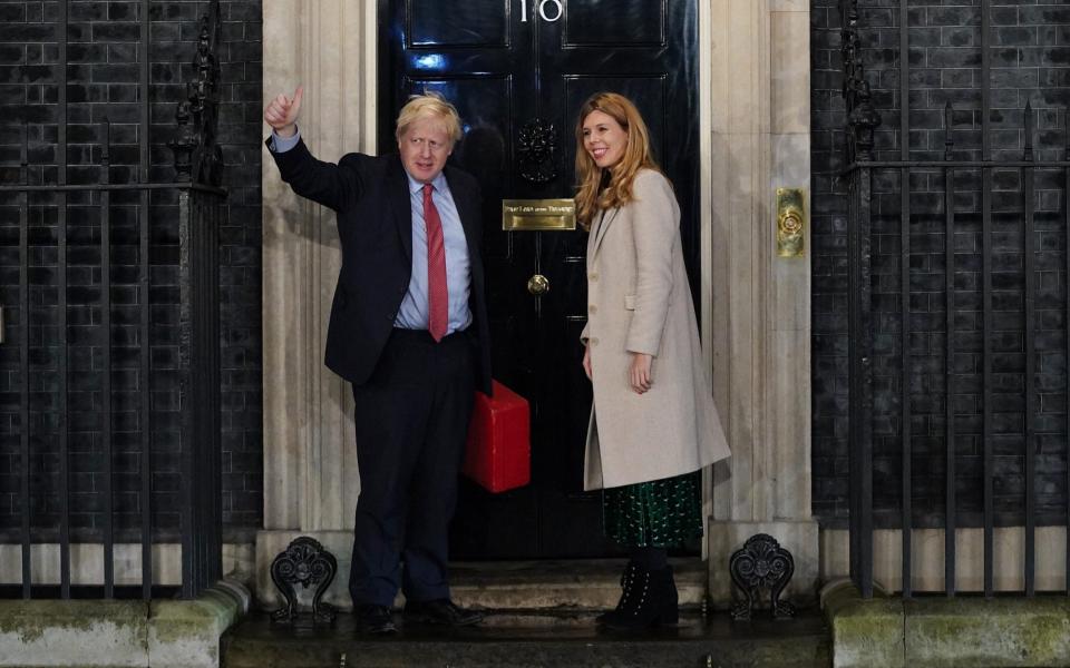 Prime Minister Boris Johnson and his partner Carrie Symonds enter Downing Street as the Conservatives celebrate a sweeping election victory on December 13, 2019 - Peter Summers /Getty
