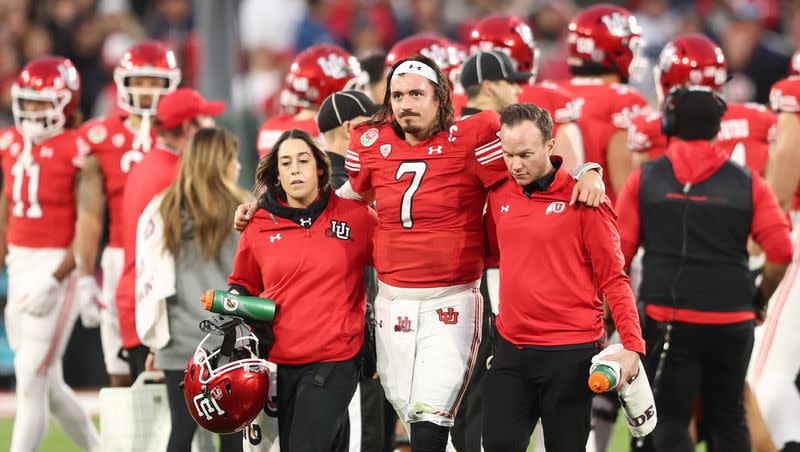 Utah Utes QB Cameron Rising (7) is helped off the field after getting injured on a run as Utah and Penn State play in the Rose Bowl in Pasadena, California, on Monday, Jan. 2, 2023. Rising tore his ACL in the bowl game and has been rehabbing this offseason.