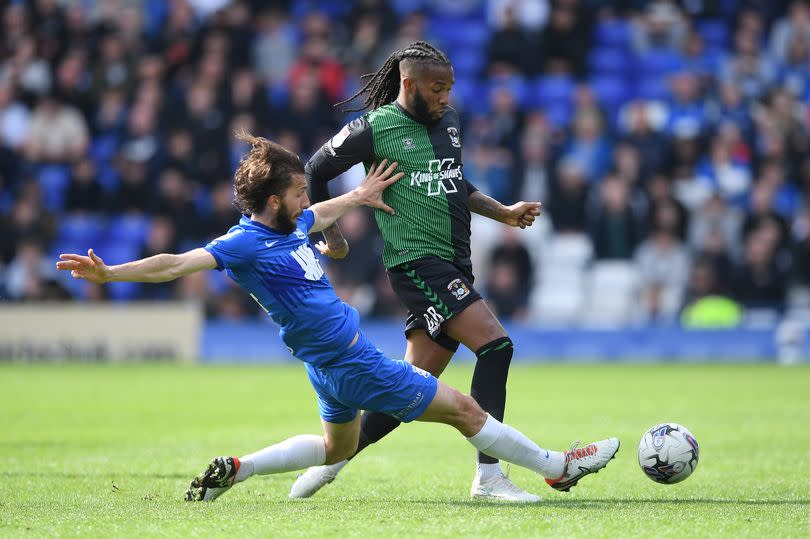 Coventry City's Kasey Palmer is challenged by Birmingham City's Ivan Sunjic