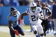 Indianapolis Colts running back Nyheim Hines (21) carries the ball past Tennessee Titans free safety Kevin Byard (31) in the second half of an NFL football game Sunday, Sept. 26, 2021, in Nashville, Tenn. (AP Photo/Wade Payne)