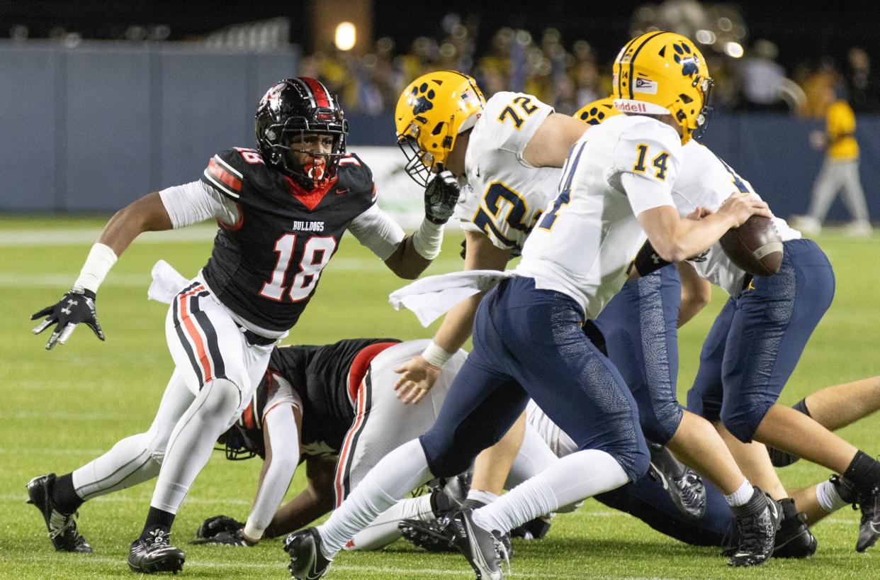 McKinley’s K'Vuone McNeal runs down St. Ignatius’s quarterback Joshua Papesh for a sack Friday, Nov. 3, 2023.