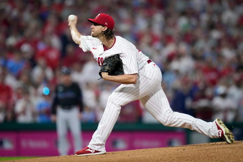 Philadelphia Phillies' Aaron Nola pitches during the first inning of Game 2 in an NL wild-card baseball playoff series against the Miami Marlins, Wednesday, Oct. 4, 2023, in Philadelphia. (AP Photo/Matt Slocum)