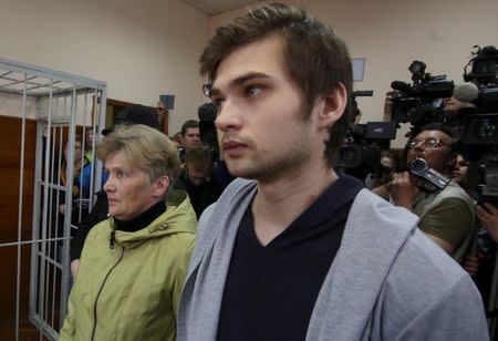 Ruslan Sokolovsky, a blogger who is accused by a state prosecutor for playing Pokemon Go inside an Orthodox church, appears with his mother Yelena Chingina in a court during his sentencing in Yekaterinburg, Russia May 11, 2017. REUTERS/Alexei Kolchin