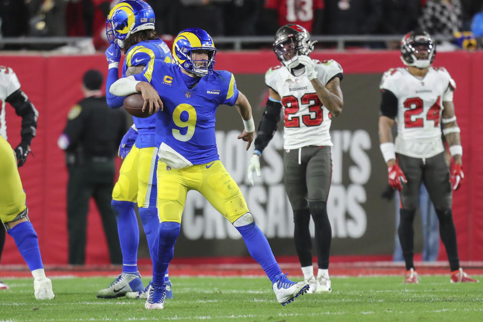 Los Angeles Rams quarterback Matthew Stafford (9) celebrates with four seconds left during a NFL divisional playoff football game against the Tampa Bay Buccaneers, Sunday, January 23, 2022 in Tampa, Fla. (AP Photo/Alex Menendez)