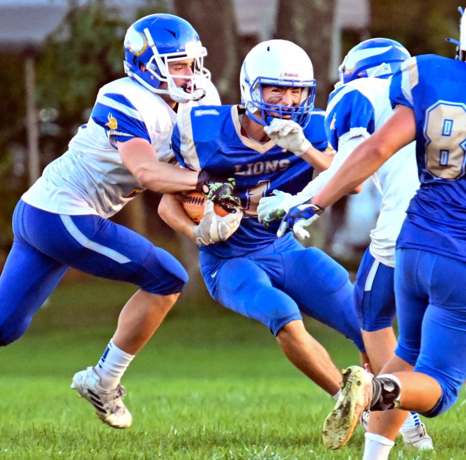 Jack Hyde of St. John Paul II attempts to get between two Wareham players in this Thursday matchup in Sandwich.