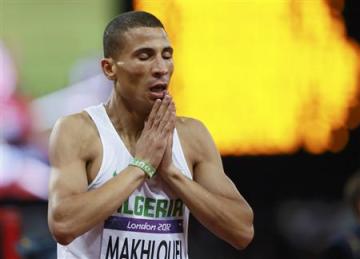 Algeria's Taoufik Makhloufi reacts after he won the men's 1500m final during the London 2012 Olympic Games at the Olympic Stadium August 7, 2012. REUTERS/Lucy Nicholson