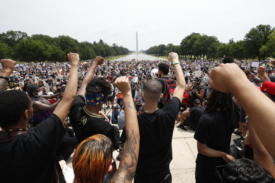 Demonstrators protest Saturday, June 6, 2020, at the Lincoln Memorial in Washington, over the death of George Floyd, a black man who was in police custody in Minneapolis. Floyd died after being restrained by Minneapolis police officers. (AP Photo/Alex Brandon)