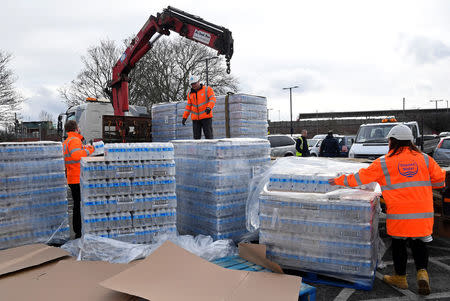 A lorry unloads bottled water distributed by Thames Water after mains supplies to homes were cut off following bad weather, in Balham, south London, March 5, 2018. REUTERS/Toby Melville