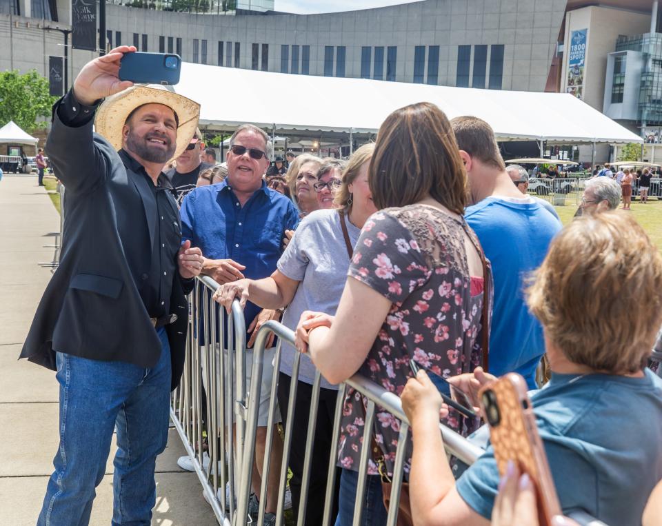 Garth Brooks snaps selfie with fans, Music City Walk of Fame induction ceremony, May 4, 2023