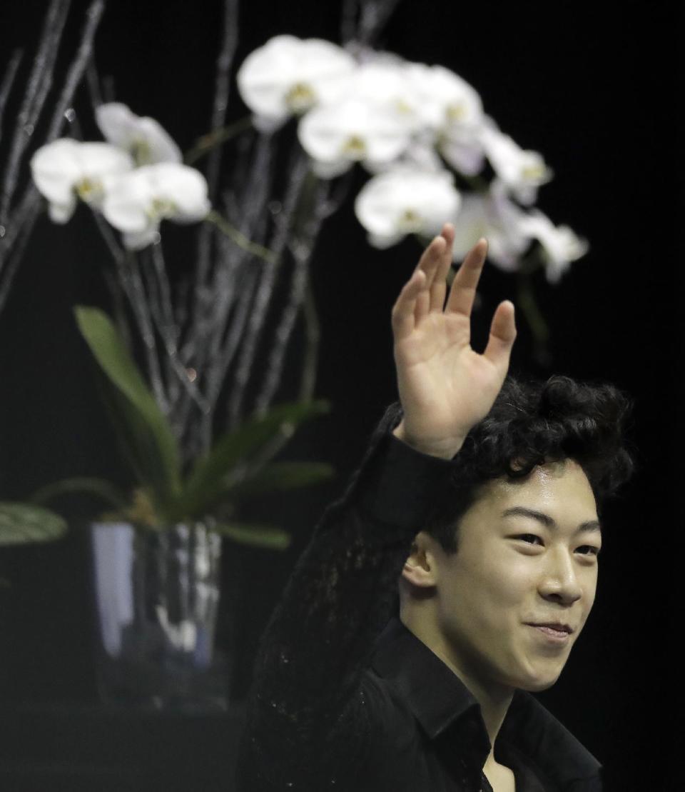 Nathan Chen waves to the crowd after his score was announced in the men's short program at the U.S. Figure Skating Championships on Friday, Jan. 20, 2017, in Kansas City, Mo. (AP Photo/Charlie Riedel)