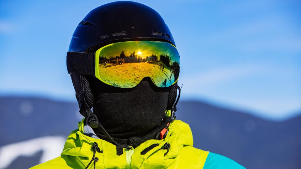 Man in snowboard mask helmet and balaclava