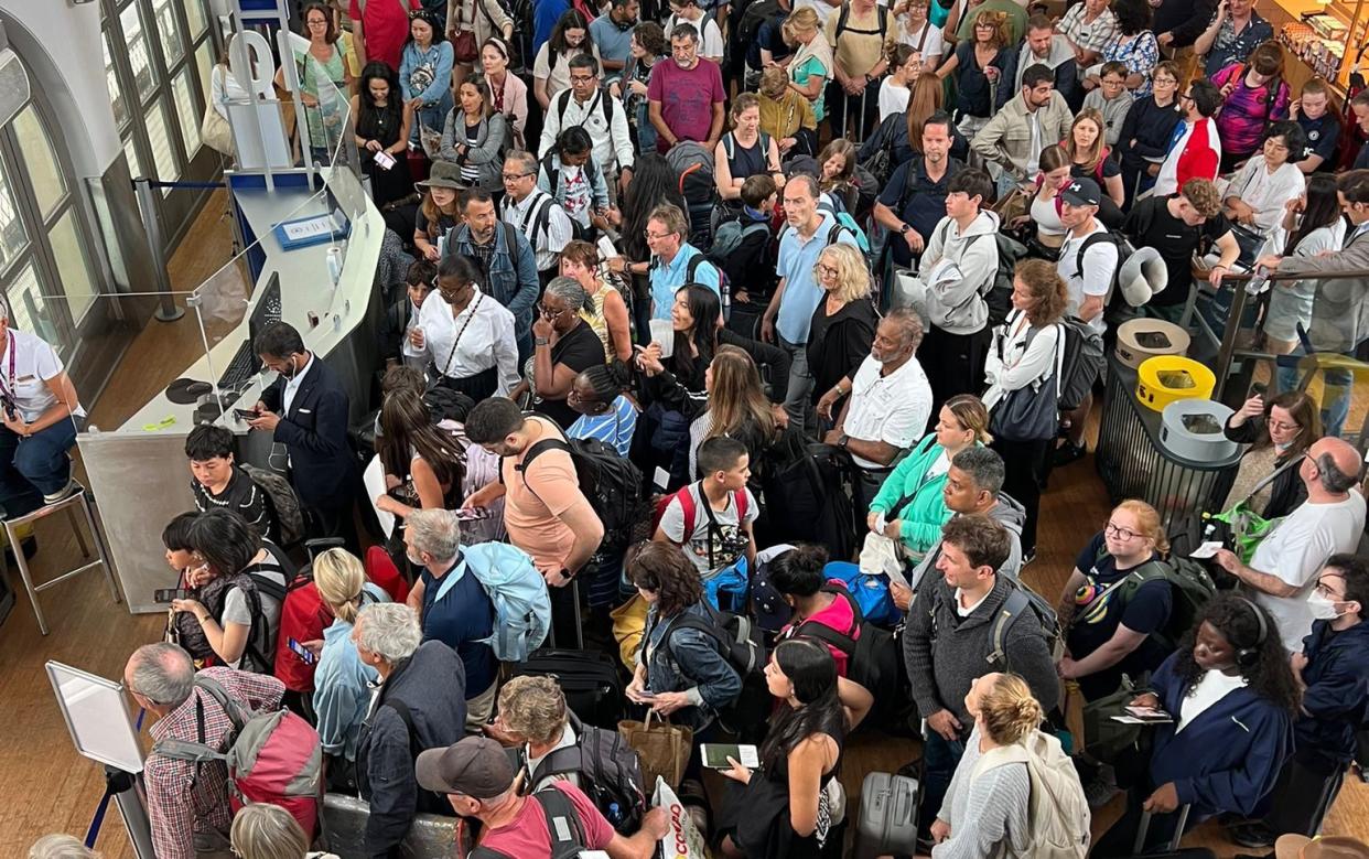 Passengers queuing at the Gare Du Nord train station in Paris, France