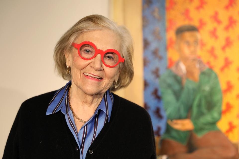 CEO Janet Langsam inside the vault at ArtsWestchester in White Plains March 21, 2024. Langsam is retiring in June after 33 years on the job. A painting by Fidelis Izekor is behind her.