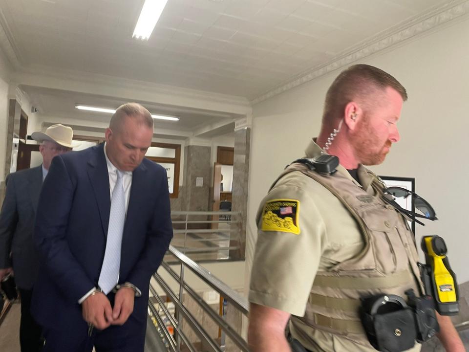 Joel Koskan leaves a Hughes County courtroom after pleading guilty to two counts of felony incest in Pierre on Tuesday April 11.