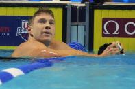 Ryan Murphy reacts after his heat in the men's 200 backstroke during wave 2 of the U.S. Olympic Swim Trials on Thursday, June 17, 2021, in Omaha, Neb. (AP Photo/Charlie Neibergall)