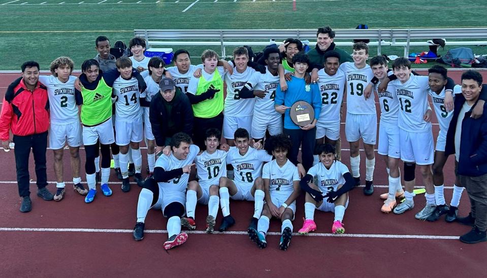 The Spackenkill boys soccer team poses at Mitchel Athletic Complex after beating Carle Place to win the Class B regional final on Nov. 3, 2023.
