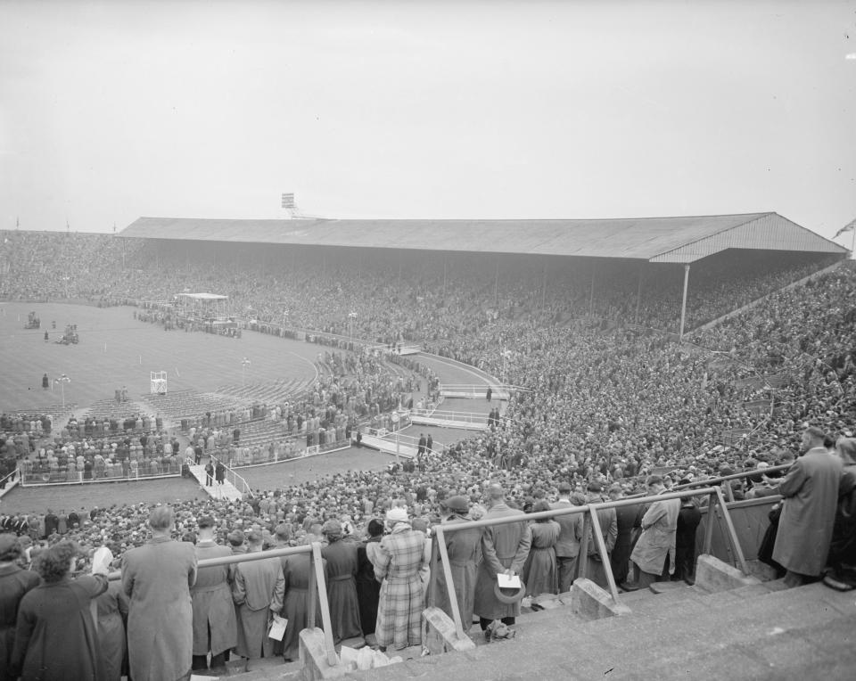 Crowds listen with rapt attention to a Graham sermon at Wembley&nbsp;Stadium in London on May 16, 1955.