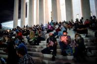 People gather in front of the U.S. Supreme Court following the death of U.S. Supreme Court Justice Ruth Bader Ginsburg, in Washington