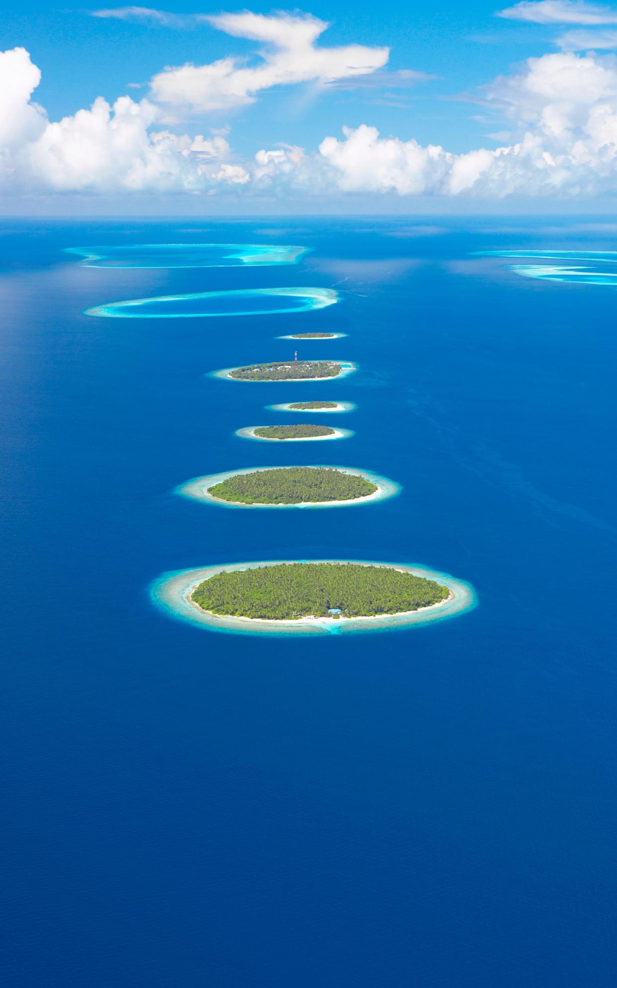 Flying over Baa Atoll in the Maldives - Sakis Papadopoulos