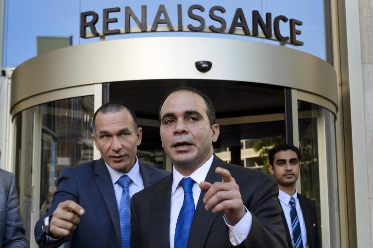 Jordanian prince and FIFA vice president Prince Ali bin al Hussein (C), challenger to Sepp Blatter for FIFA presidency, leaves a Zurich hotel on May 27, 2015