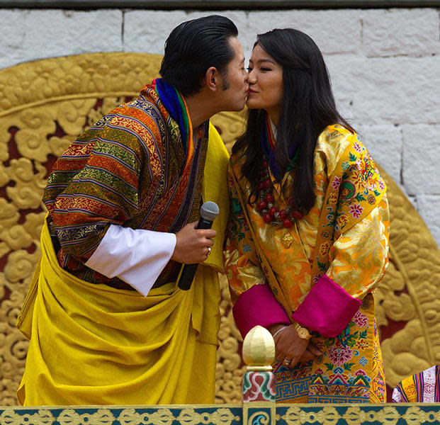 King Jigme Khesar Namgyel Wangchuck and Queen Jetsun Pema, kissing on their wedding day 