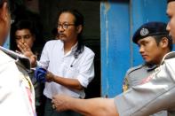 Filmmaker Min Htin Ko Ko Gyi arrives at Insein court before his trial in Yangon