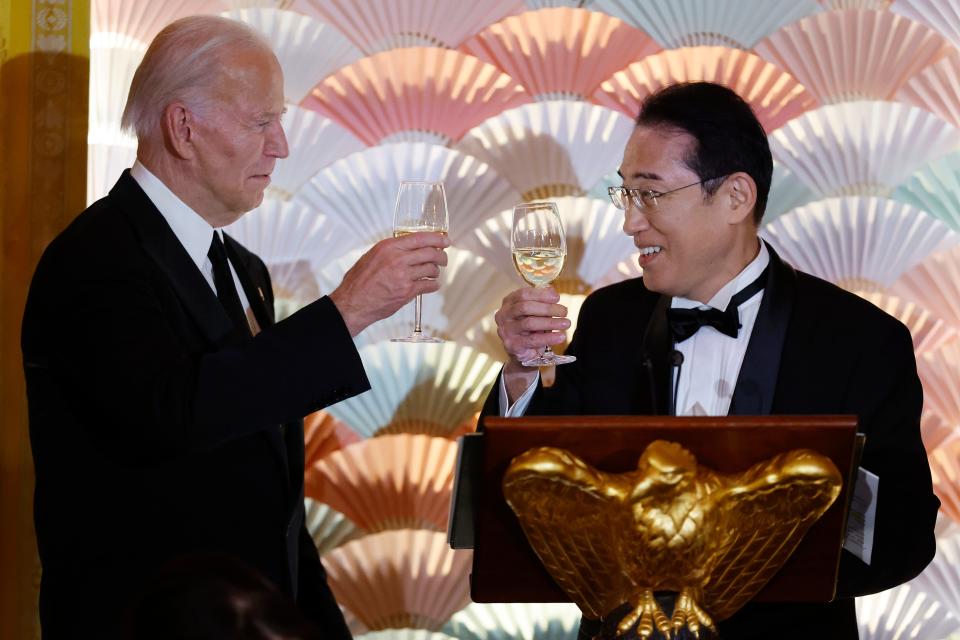 President Joe Biden and Japanese Prime Minister Fumio Kishida toast each other during a state dinner in the East Room of the White House on April 10, 2024 in Washington, DC.