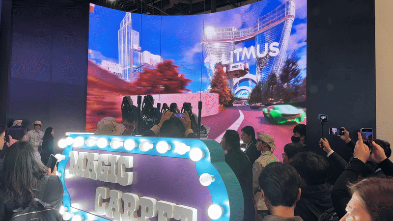 An SK demo called Magic Carpet with four people in a suspended seat flying through a fake city as if they were on a flying car.