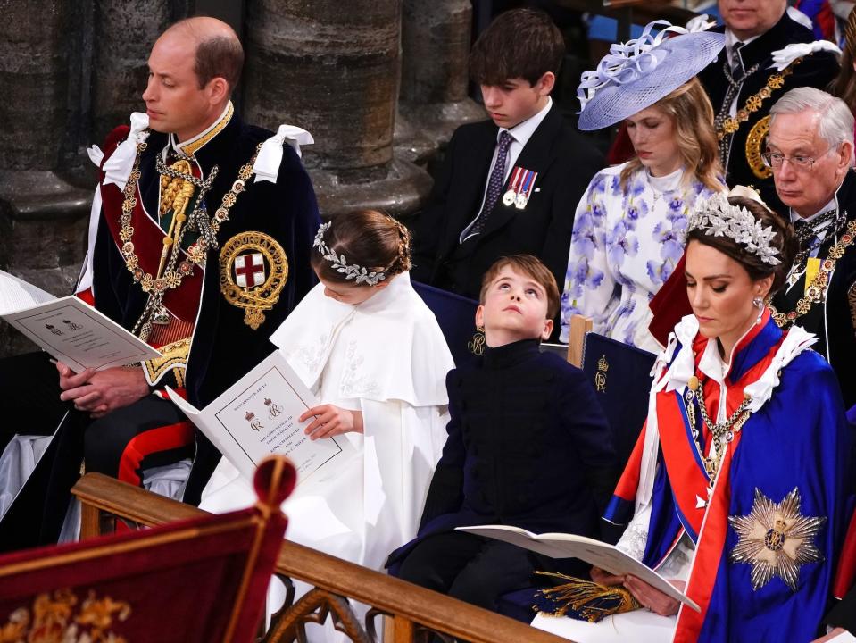 Prince Louis looks around Westminster Abbey at King Charles III's coronation.