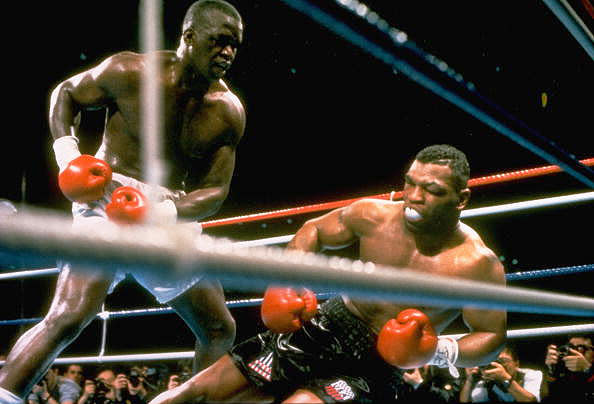 9. Buster Douglas KO10 Mike Tyson, Feb. 10, 1990 – Tyson was a 42-1 favorite to defend his IBF/WBA/WBC heavyweight titles, but he was in trouble right from the start. He had a powerful jab that he kept popping in Tyson's face. Tyson dropped Douglas in the eighth, nearly saving his title, but Douglas came back strong. He hit Tyson with an uppercut and then a series of shots, that dropped Tyson. Tyson was unable to get up and suffered his first, and most stunning, defeat. (Photo credit: Getty)