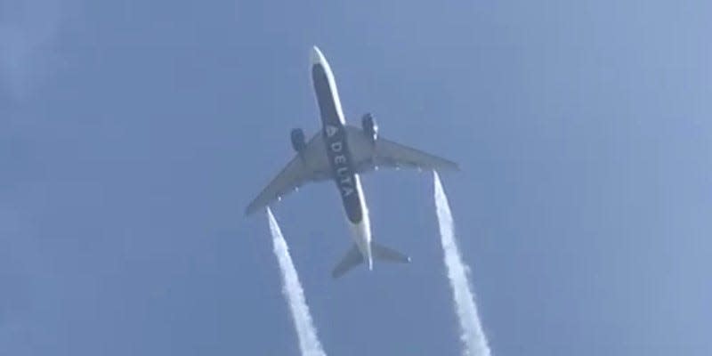 FILE PHOTO: A Delta Airlines, Flight 89, Boeing 777-200 jet empties its fuel tanks as it makes an emergency landing at Los Angeles International Airport, seen from Ocean View Elementary School in Whittier, California, U.S., January 14, 2020 in this still video image obtained by REUTERS 