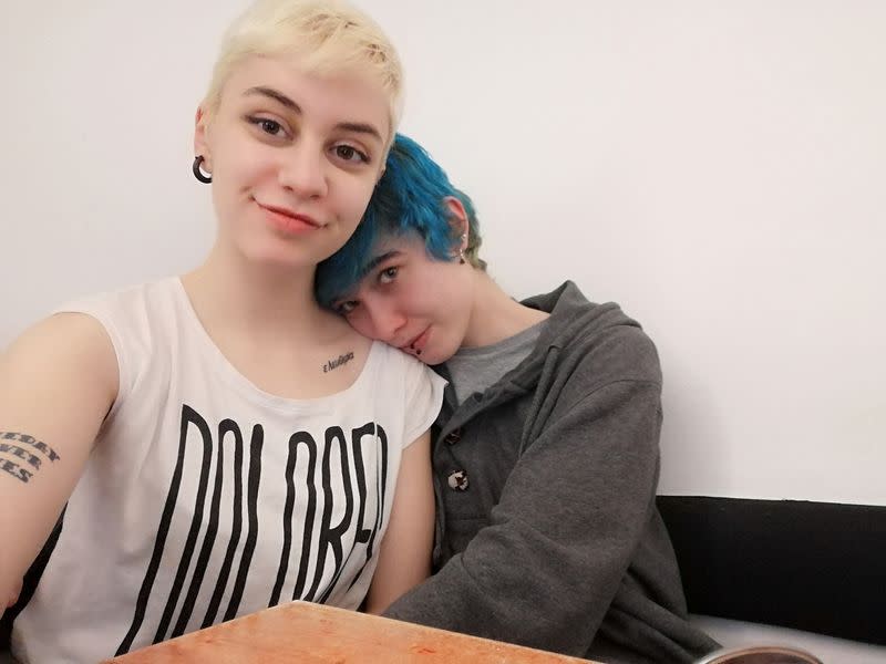 Lola Gomez and her girlfriend Sara Lozano embrace in their home in Madrid, before the coronavirus outbreak