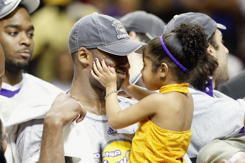 Kobe Bryant #24 of the Los Angeles Lakers holds his daughter, Gianna, after the Lakers defeated the Orlando Magic in Game Five of the 2009 NBA Finals on June 14, 2009 at Amway Arena in Orlando, Florida. The Lakers won 99-86. (Photo by Ronald Martinez/Getty Images)