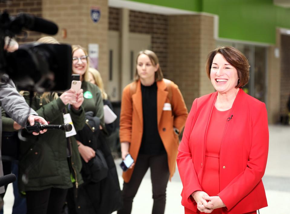 U.S. Sen. Amy Klobuchar of Minnesota takes part in a national interview as Johnston residents gather to discuss important issues while declaring their presidential preference in a public meeting during the 2020 Iowa Democratic Party Caucus at Precinct 1 and 2 in the gymnasium at Johnston Middle School on Monday, Feb. 3, 2020.