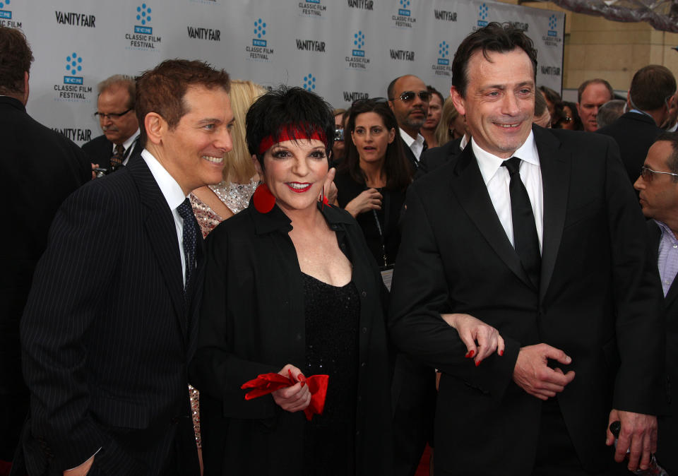 HOLLYWOOD, CA - APRIL 12: Actress Liza Minnelli (C) and her guest attend the 2012 TCM Classic Film Festival Opening Night Premiere Of The 40th Anniversary Restoration Of "Cabaret" at Grauman's Chinese Theatre on April 12, 2012 in Hollywood, California. (Photo by Frederick M. Brown/Getty Images)