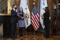 Vice President Kamala Harris, right, ceremonially swears-in Antony Blinken, left, as Secretary of State, next to his wife Evan Ryan, Wednesday Jan. 27, 2021, in Harris' ceremonial office in the Eisenhower Executive Office Building on the White House complex in Washington. (AP Photo/Jacquelyn Martin)
