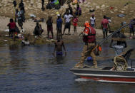 Members of Mexico's Migration Institute patrol the area of the Rio Grande that separates the cities of Del Rio, Texas, and Ciudad Acuña, Mexico, Wednesday, Sept. 22, 2021. (AP Photo/Fernando Llano)