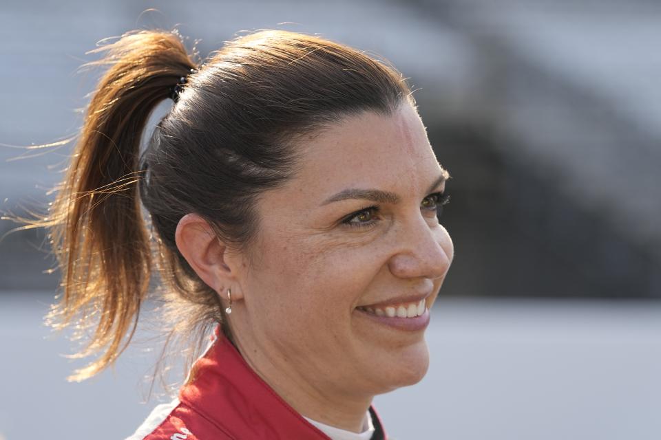 Katherine Legge, of England, smiles after she qualified for the Indianapolis 500 auto race at Indianapolis Motor Speedway, Saturday, May 20, 2023, in Indianapolis. (AP Photo/Darron Cummings)