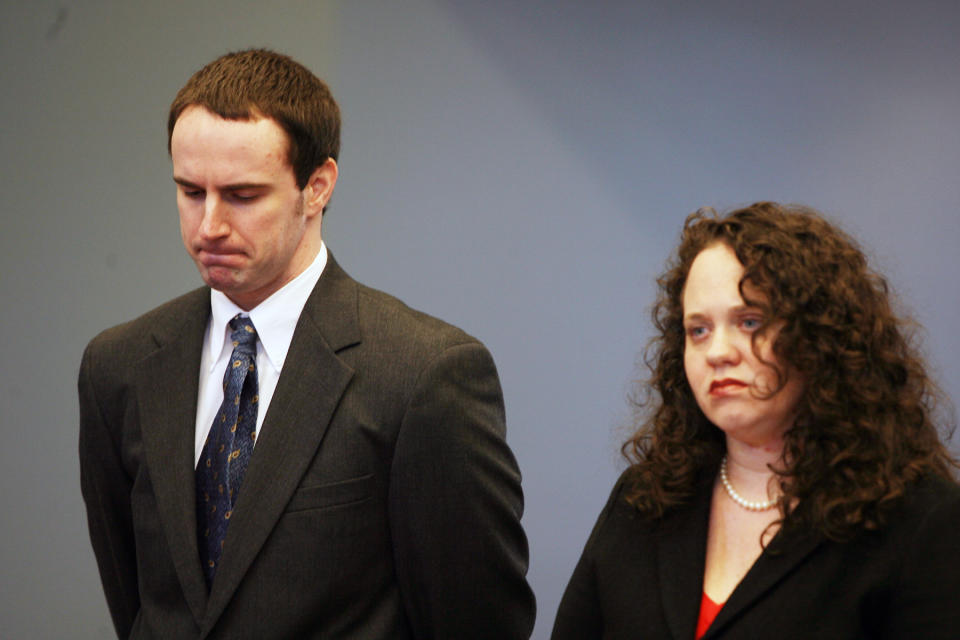 U.S. Army Pvt. Christopher Salmon, left, accompanied by his attorney, Gabrielle Amber Pittman, listens during a hearing Thursday, April 3, 2014, in a Long County, Ga. courtroom. Salmon pleaded guilty to malice murder charges in the killing of former military colleague Michael Roark, and was sentenced to life in prison with no chance of parole. (AP Photo/Lewis Levine)