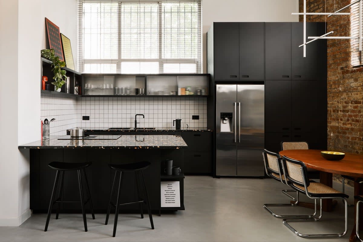 A Dalston kitchen using Valchromat throughout, white tiling with black grouting and black terrazzo worktops (HØLTE)