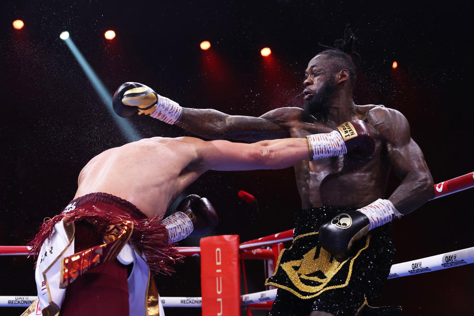 RIYADH, SAUDI ARABIA - DECEMBER 23: Deontay Wilder and Joseph Parker exchange punches during the WBC International & WBO Intercontinental Heavyweight title fight between Deontay Wilder and Joseph Parker during the Day of Reckoning: Fight Night at Kingdom Arena on December 23, 2023 in Riyadh, Saudi Arabia. (Photo by Richard Pelham/Getty Images)