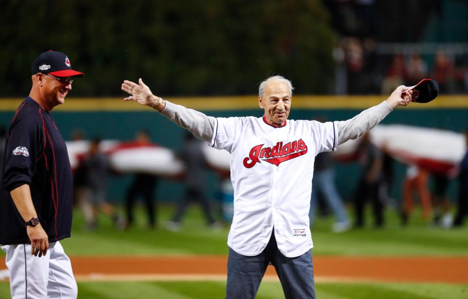 The late John "Tito" Francona, right, former Cleveland outfielder and father of manager Terry Francona, left, reacts after throwing a ceremonial first pitch before Game 1 of an American League Division Series against the Boston Red Sox, Oct. 6, 2016, in Cleveland.