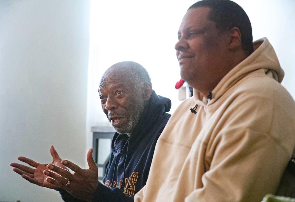 George McClain, left, talks about his friend, Cleveland Cavaliers legend "Bingo" Smith, with Smith's son Andre, 48, on Jan. 4 in Akron. McClain was close friends with Smith and drove him to team appearances for years.