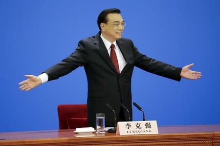 China's Premier Li Keqiang gestures as he arrives for a news conference following the closing ceremony of China's National People's Congress (NPC) at the Great Hall of the People in Beijing, China, March 16, 2016. REUTERS/Jason Lee -