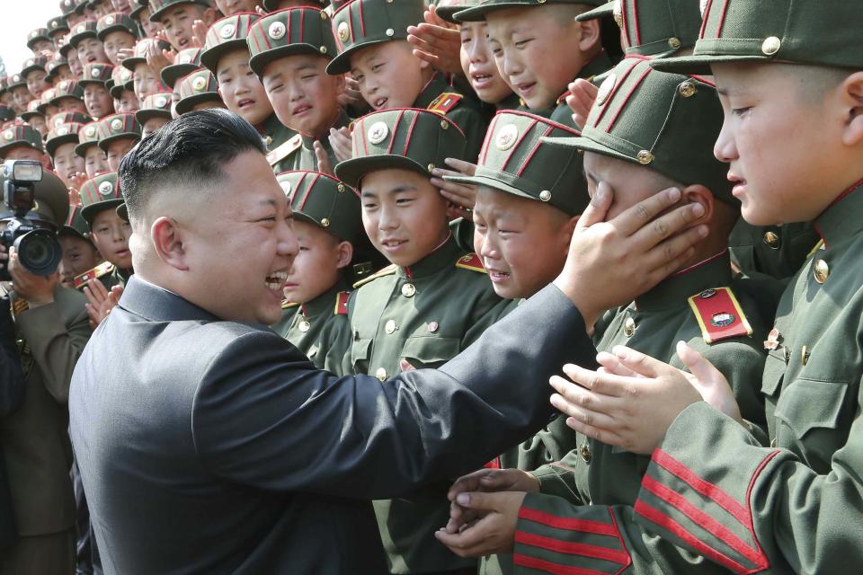 North Korean leader Kim Jong Un visits Mangyongdae Revolutionary School on the occasion of the 68th anniversary of the founding of the Korean Children's Union (KCU) in this undated photo released by North Korea's Korean Central News Agency (KCNA) in Pyongyang June 7, 2014. REUTERS/KCNA (NORTH KOREA - Tags: POLITICS IMAGES OF THE DAY) ATTENTION EDITORS - THIS PICTURE WAS PROVIDED BY A THIRD PARTY. REUTERS IS UNABLE TO INDEPENDENTLY VERIFY THE AUTHENTICITY, CONTENT, LOCATION OR DATE OF THIS IMAGE. FOR EDITORIAL USE ONLY. NOT FOR SALE FOR MARKETING OR ADVERTISING CAMPAIGNS. THIS PICTURE IS DISTRIBUTED EXACTLY AS RECEIVED BY REUTERS, AS A SERVICE TO CLIENTS. NO THIRD PARTY SALES. NOT FOR USE BY REUTERS THIRD PARTY DISTRIBUTORS. SOUTH KOREA OUT. NO COMMERCIAL OR EDITORIAL SALES IN SOUTH KOREA