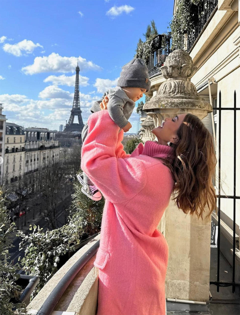 Camila Coelho and her son, Kai on a Paris balcony