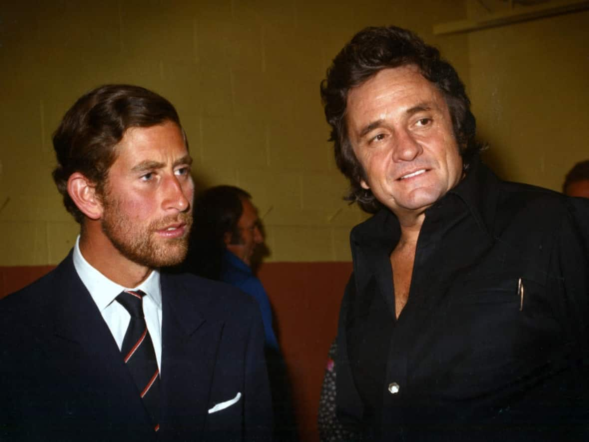 Johnny Cash’s people ordered the largest blow-up they could get of this photo of him meeting then-Prince Charles, said Libby Burnham, for the Johnny Cash museum in Nashville, Tennessee. It was taken backstage at a concert in Fredericton, she said, by a photographer she'd hired from Harvey Studios, named Harry Mullin. (Harvey Studios - image credit)